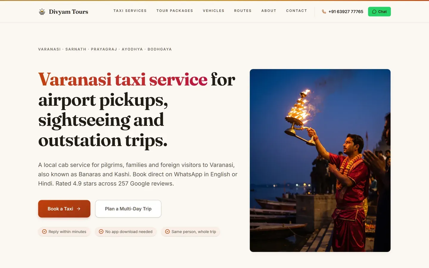 The Divyam Tours homepage on desktop, with a service-led headline, booking buttons and a photograph of the Ganga aarti in Varanasi.