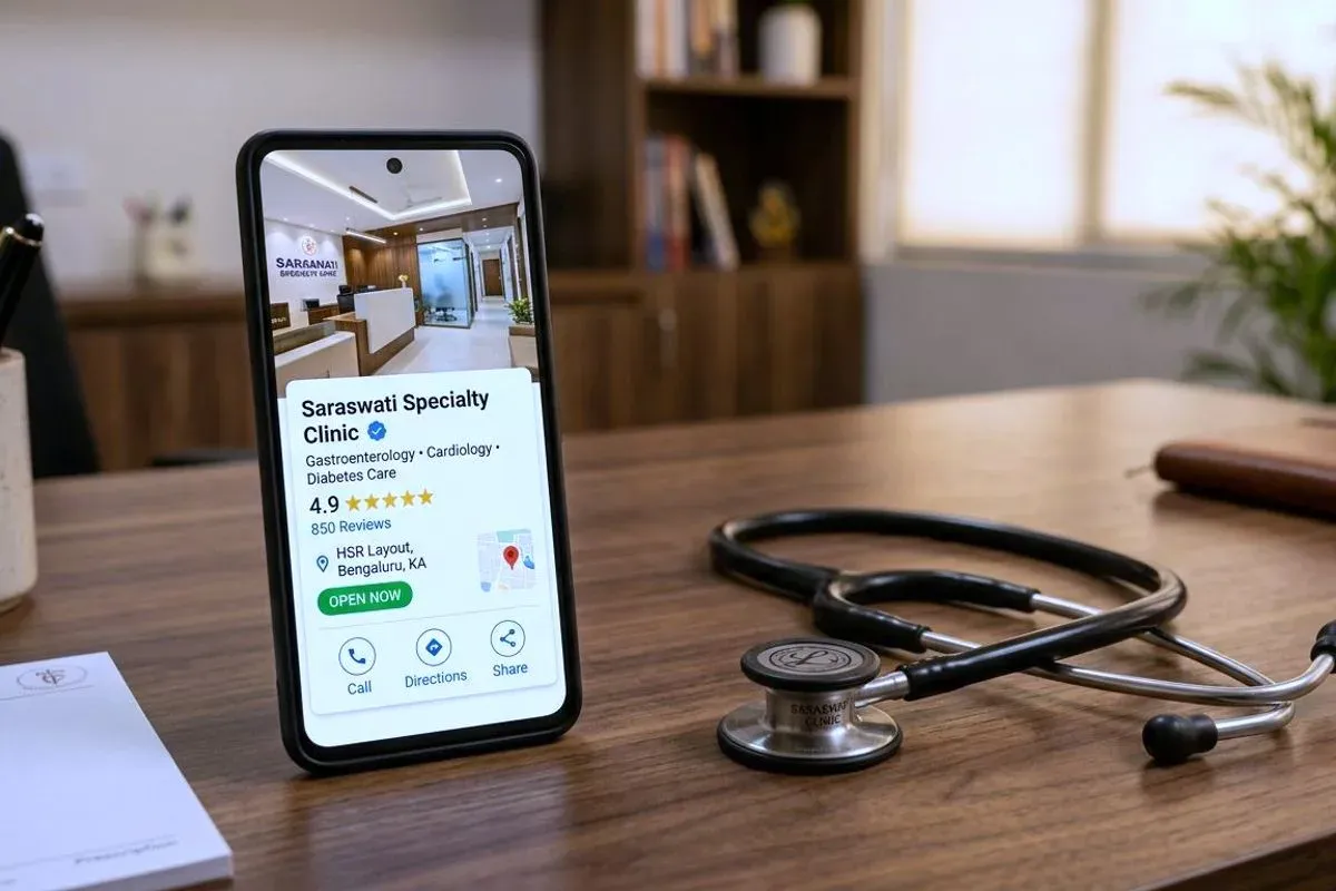 A completed Google Business Profile open on a phone standing on a desk, a stethoscope beside it.